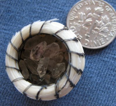 Tiny quartz crystals in a horsehair basket
