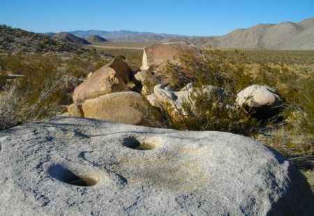 Morteros worn into the granite boulder!